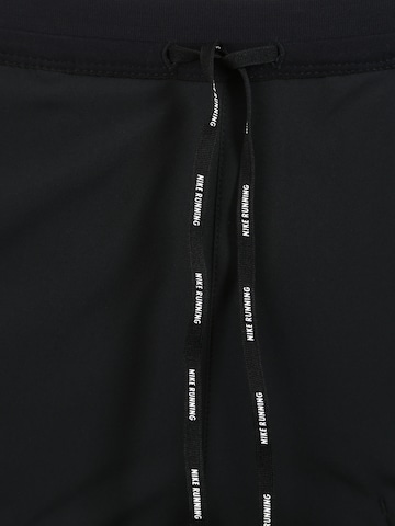 NIKE Regular Workout Pants 'Flex Stride' in Black