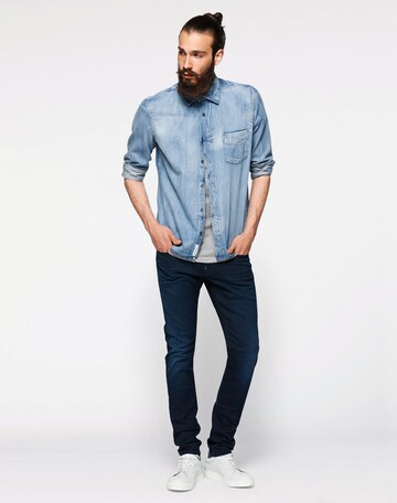 Slimfit Jeans 'Revend' de la G-Star RAW pe albastru