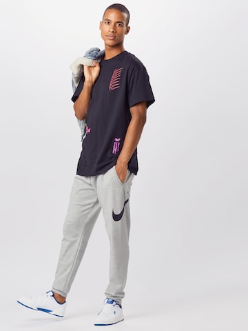 NIKE Tapered Sportbroek in Grijs