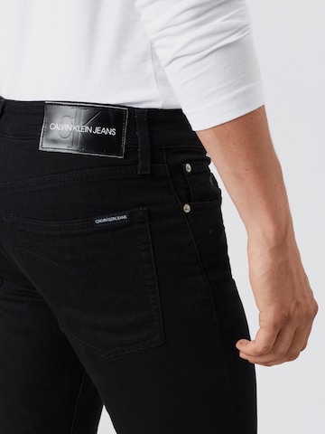 Calvin Klein Jeans Slimfit Farkut 'CKJ 026 SLIM' värissä musta