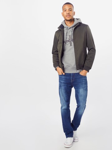 Sweat-shirt 'TAPING THROUGH MONOGRAM HOODIE' Calvin Klein Jeans en gris
