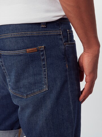 Carhartt WIP Regular Jeans 'Swell' in Blauw