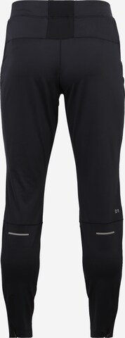 Regular Pantalon de sport ASICS en noir : derrière