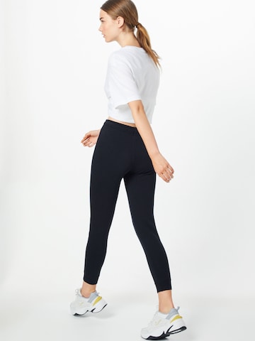 Nike Sportswear Tapered Trousers in Black: back