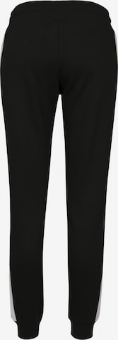 Tapered Pantaloni di Urban Classics in nero