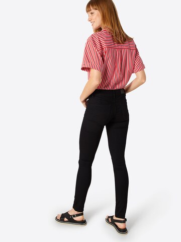 Skinny Jeans de la Tommy Jeans pe negru: spate