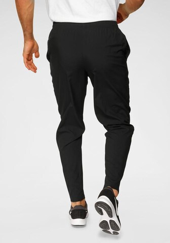 Regular Pantalon de sport 'RUN STRIPE' NIKE en noir