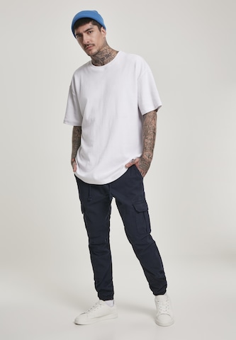 Urban Classics - Tapered Calças cargo em azul