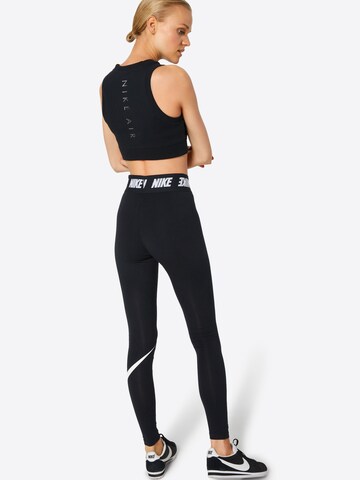 Skinny Leggings de la Nike Sportswear pe negru: spate