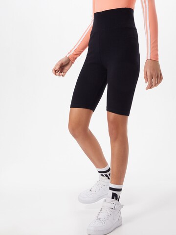 Urban Classics Skinny Leggings in Black: front