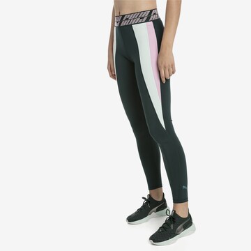 PUMA Skinny Spodnie sportowe 'Own It' w kolorze zielony