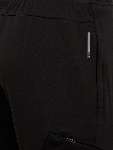 Effilé Pantalon de sport PUMA en noir