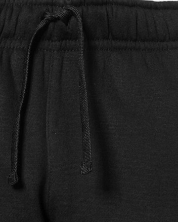 Effilé Pantalon 'Club' Nike Sportswear en noir