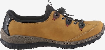 Pantofi cu șireturi sport de la Rieker pe galben