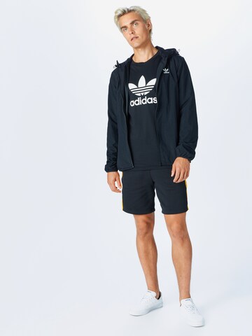 Coupe regular Veste mi-saison ADIDAS ORIGINALS en noir