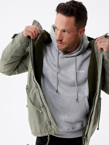 DAN FOX APPAREL Tussenparka 'Jake ' in Groen