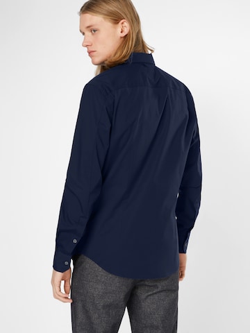 Coupe slim Chemise Tommy Jeans en bleu : derrière