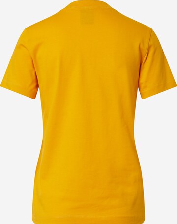 Maglietta di Champion Authentic Athletic Apparel in giallo