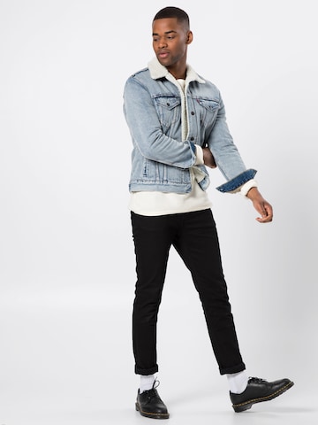 LEVI'S ® Between-Season Jacket 'Type 3 Sherpa Trucker' in Blue