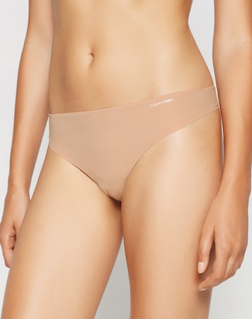 Calvin Klein Underwear Tanga – béžová: přední strana