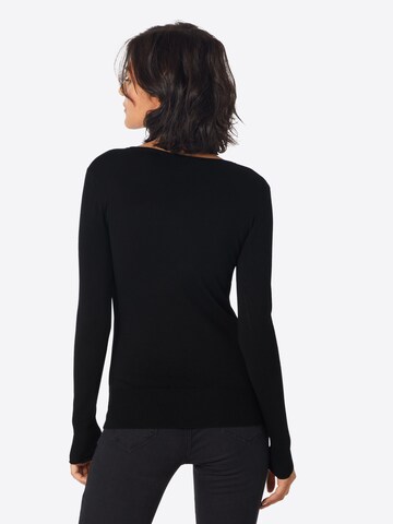 Pull-over GUESS en noir : derrière