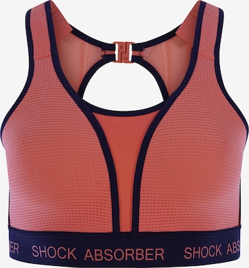 SHOCK ABSORBER Sports Bra in Orange: front