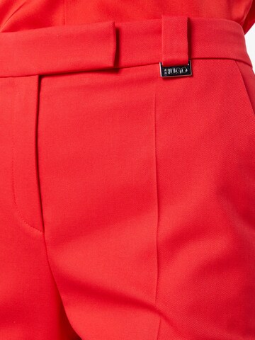 HUGO Red Bootcut Spodnie w kant 'Hularis' w kolorze czerwony