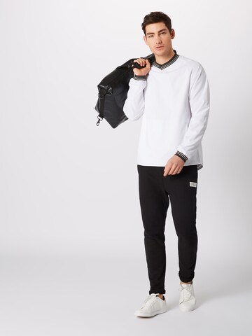 Coupe regular Veste mi-saison Urban Classics en blanc