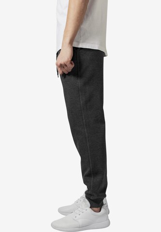 Tapered Pantaloni di Urban Classics in grigio