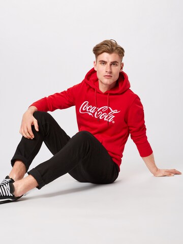 Bluză de molton 'Coca Cola' de la Merchcode pe roșu