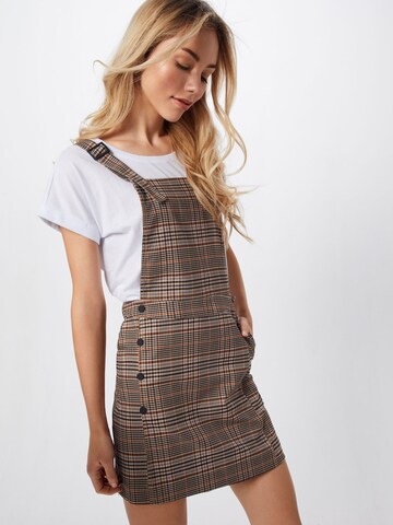 Review Overgooier 'CHECK DUNGAREEDR' in Beige: voorkant