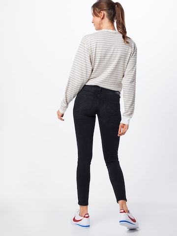 Skinny Jeans de la ONLY pe negru: spate
