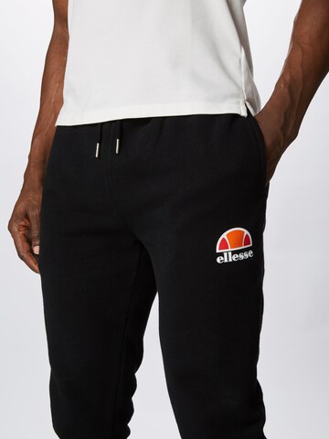 ELLESSE Zwężany krój Spodnie sportowe 'Ovest' w kolorze czarny