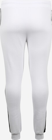 Tapered Pantaloni di Urban Classics in bianco