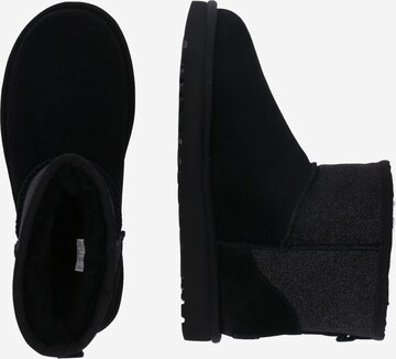 Bocanci de zăpadă 'Classic Mini Sparkle' de la UGG pe negru: lateral