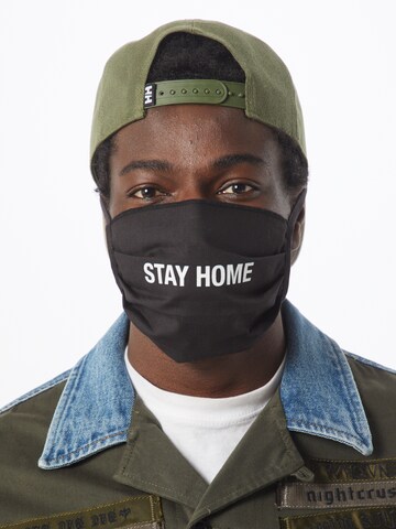 Mister Tee Stoffmaske 'Stay Home' in Schwarz