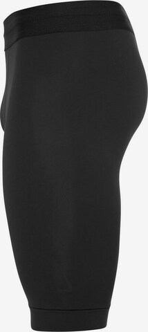 Skinny Pantaloni sport de la NIKE pe negru