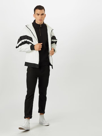 Carhartt WIP Regularny krój Bluzka sportowa 'Chase' w kolorze czarny