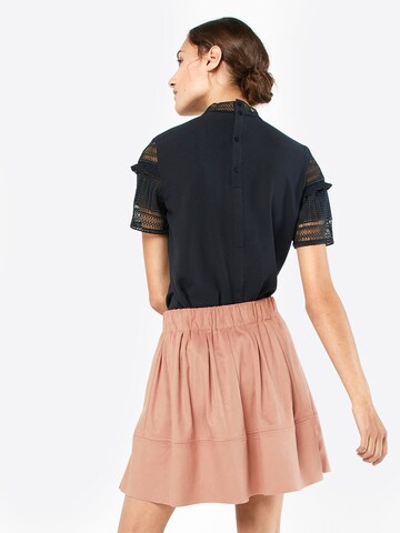 Jupe 'Kia' minimum en rose : derrière