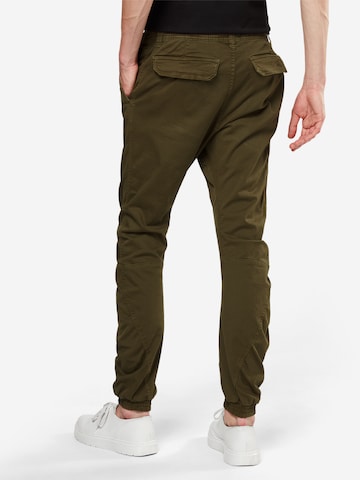 Tapered Pantaloni di Urban Classics in verde