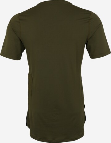 T-Shirt fonctionnel NIKE en vert : derrière
