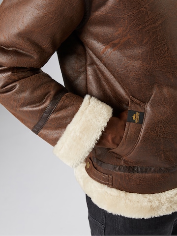 ALPHA INDUSTRIES - Casaco de inverno 'B3 FL' em castanho