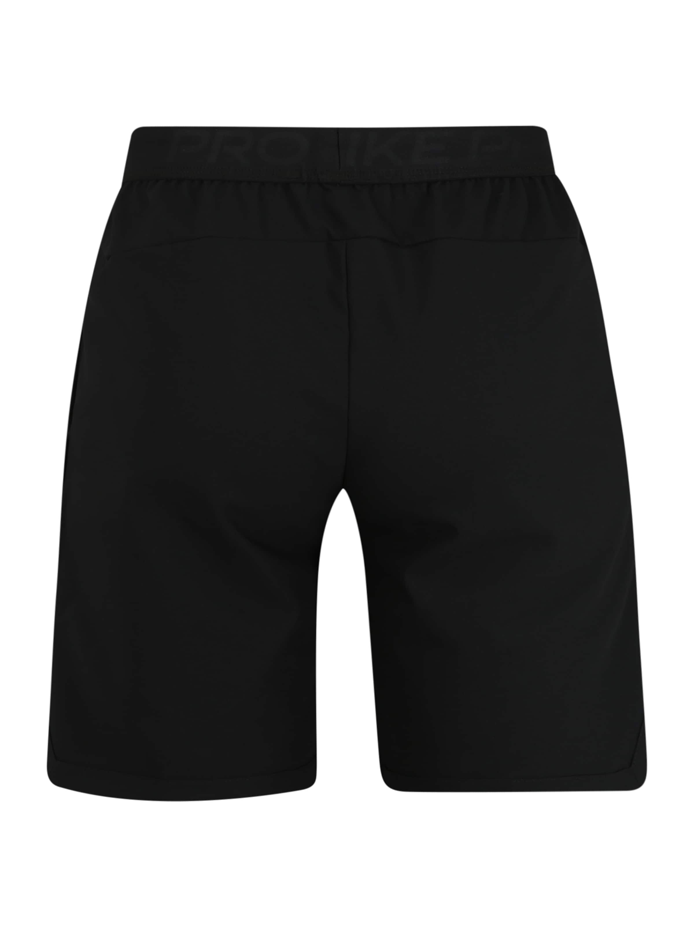 NIKE Regular Workout Pants in Black