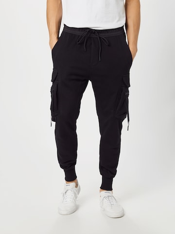 Urban Classics Tapered Cargo Pants in Black: front