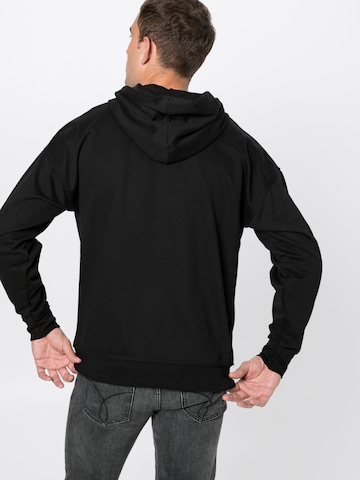 Sweat-shirt Urban Classics en noir : derrière