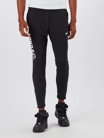 Coupe slim Pantalon de sport NIKE en noir : devant