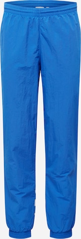 ADIDAS ORIGINALS - Tapered Pantalón 'Trefoil' en azul: frente