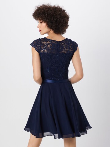 Robe de cocktail SWING en bleu : derrière