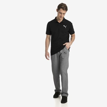 PUMA Poloshirt in Schwarz