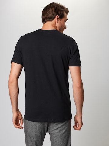 Coupe regular T-Shirt 'Prado' ELLESSE en noir : derrière